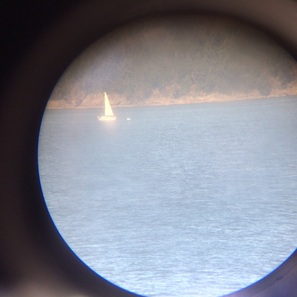Telescope view of a neighboring sailboat from the ferry to Victoria